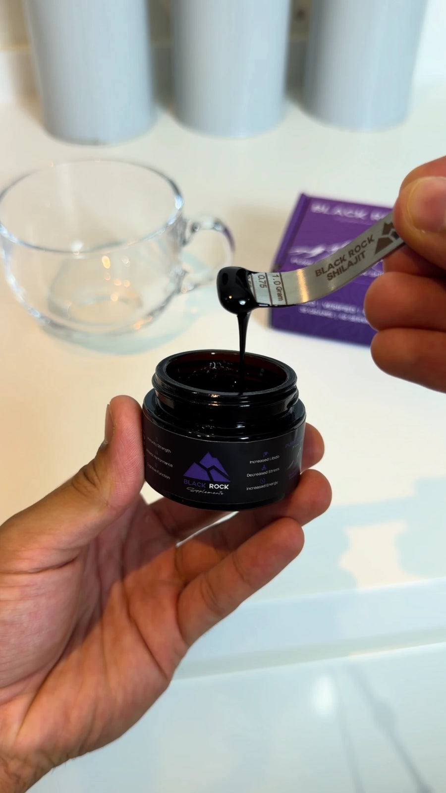 A spoonful of Black Rock Shilajit resin lifted from the jar