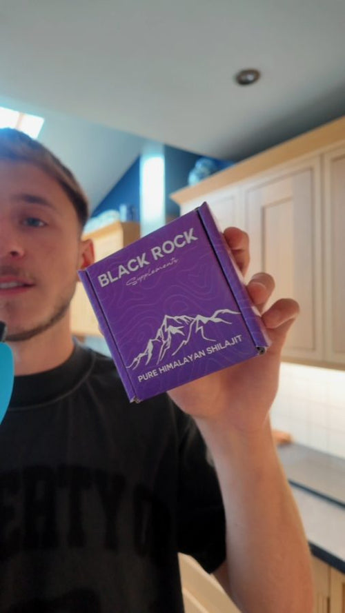 Customer holding a Black Rock Supplements box